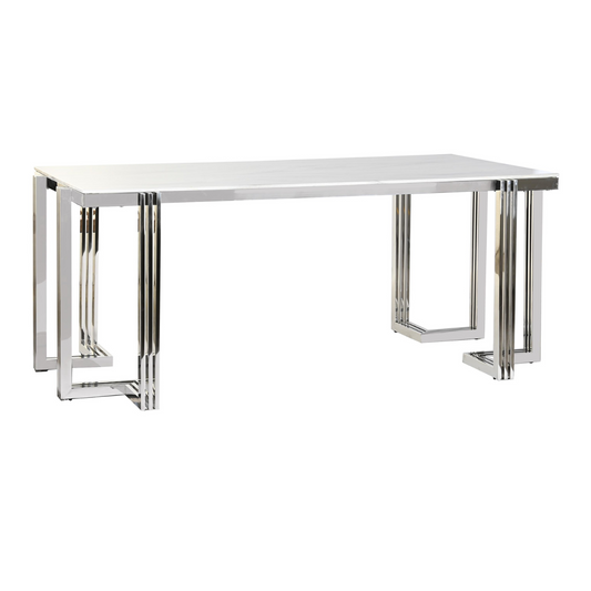 Esta mesa de comedor rectangular combina la elegancia atemporal del mármol con la modernidad del acero inoxidable en un diseño sofisticado y funcional. Su estructura de acero cromado, con líneas geométricas y ángulos pronunciados, crea un efecto visual impactante y contemporáneo. El tablero rectangular de cristal templado con efecto mármol ofrece una superficie resistente y fácil de limpiar, ideal para disfrutar de comidas en familia o con amigos. Con unas dimensiones de 180x90x76 cm, esta mesa es perfecta 